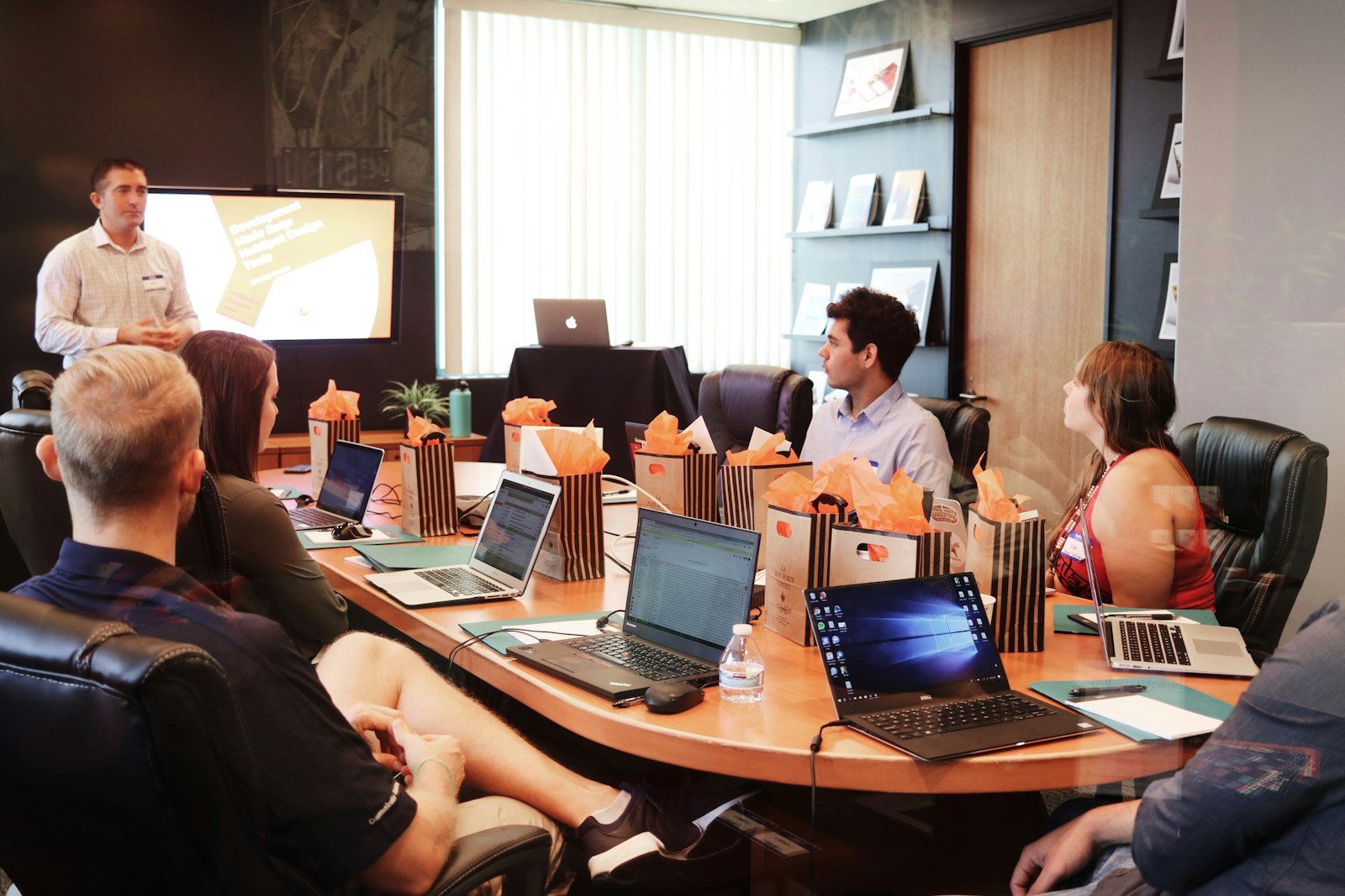 A Samriddhi consultant presenting to a client team in a boardroom